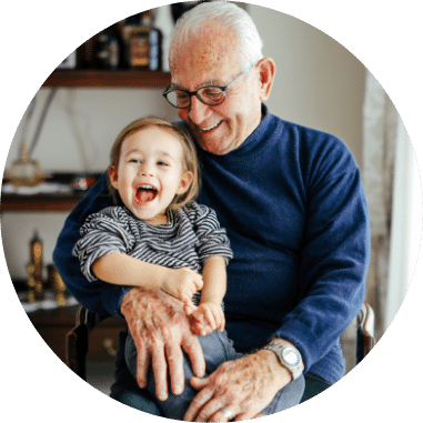 Elderly Man Holding Grandchild