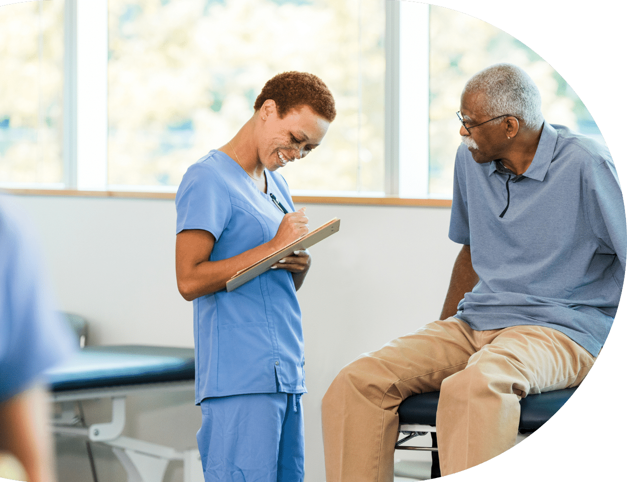Caretaker Taking Notes About Patient
