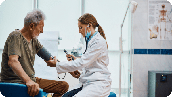 Elderly Man Getting Blood Pressure Checked