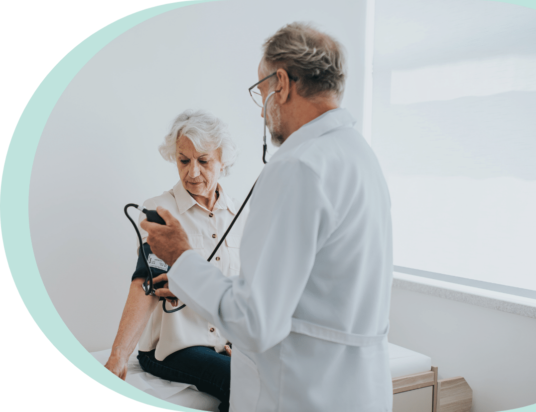 Doctor Checking Womans Blood Pressure