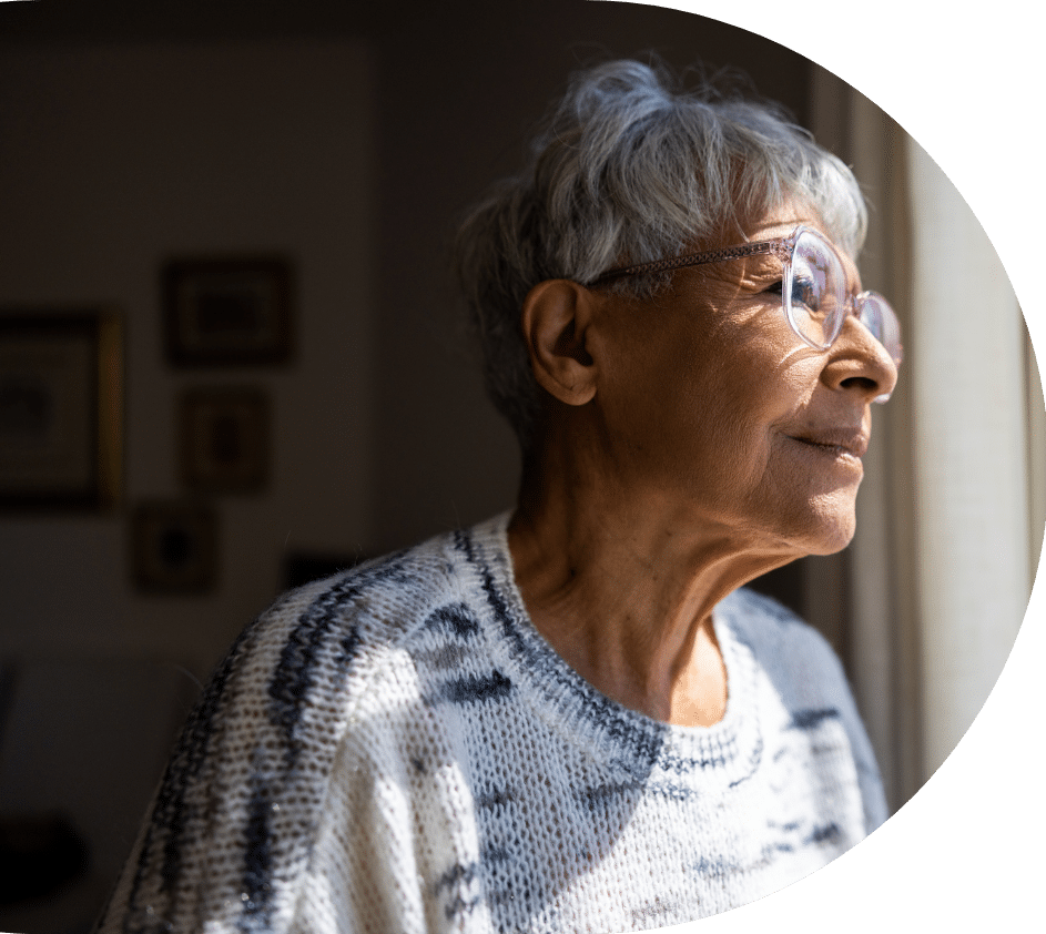 Elderly Woman Looking Out Window