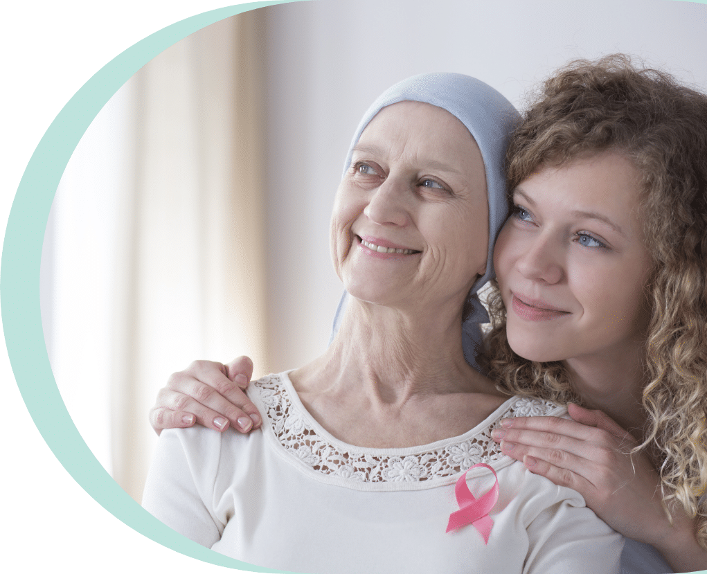 Daughter hugging her older mother who has breast cancer in seniors